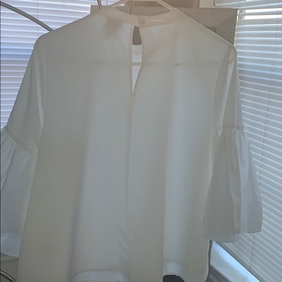 While puffer sleeve polyester blouse . - Picture 4 of 4